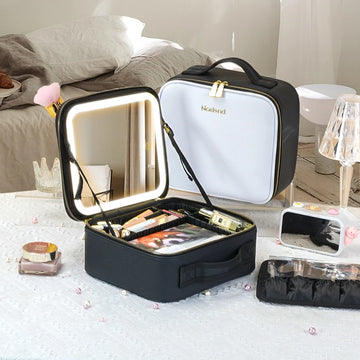 Ninna Vanity Case open with the LED mirror lit, next to the white case closed