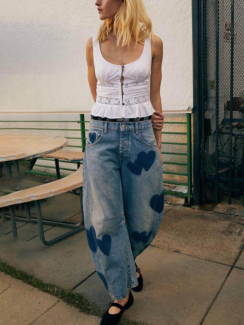 Amora Heart jeans worn with an oversized tee