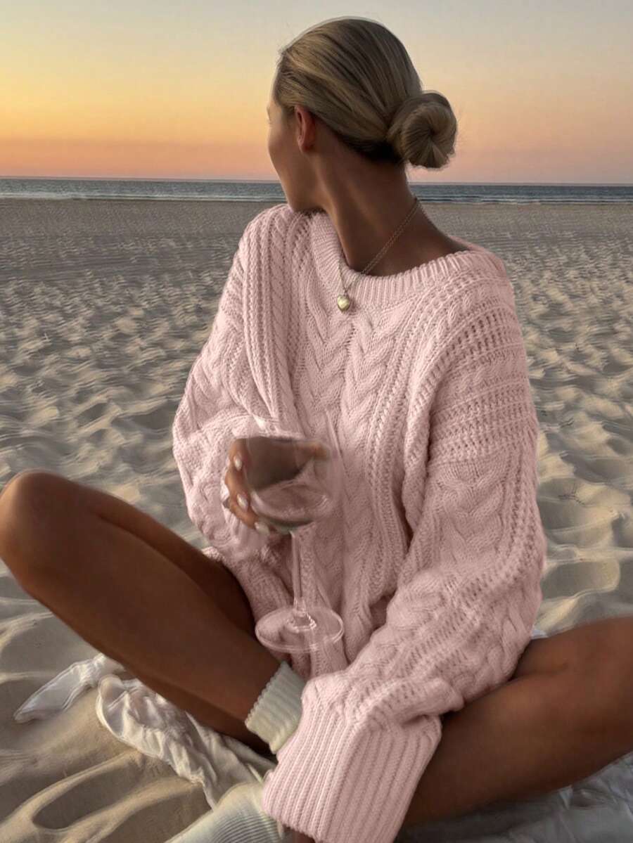 Ribbed cuff detail on the Aria cable-knit sweater