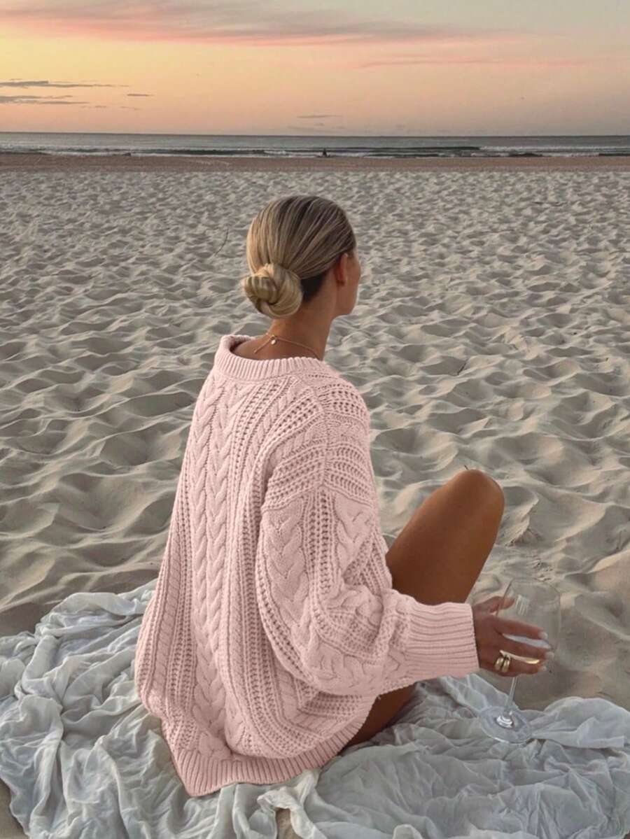 Back view of the Aria cable-knit sweater