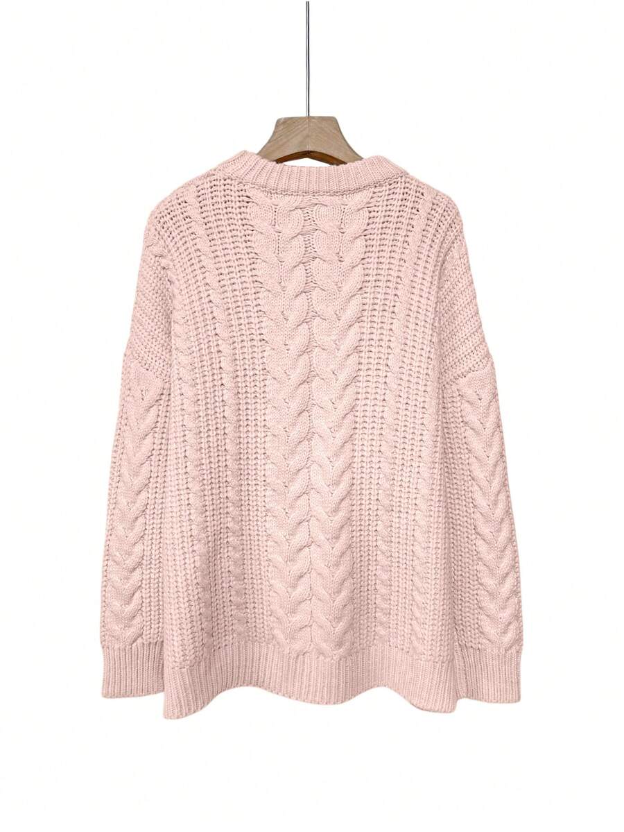 Aria cable-knit sweater shown on a model