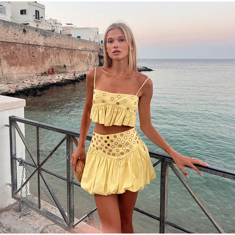 Front view of the Capri crop top and mini skirt set