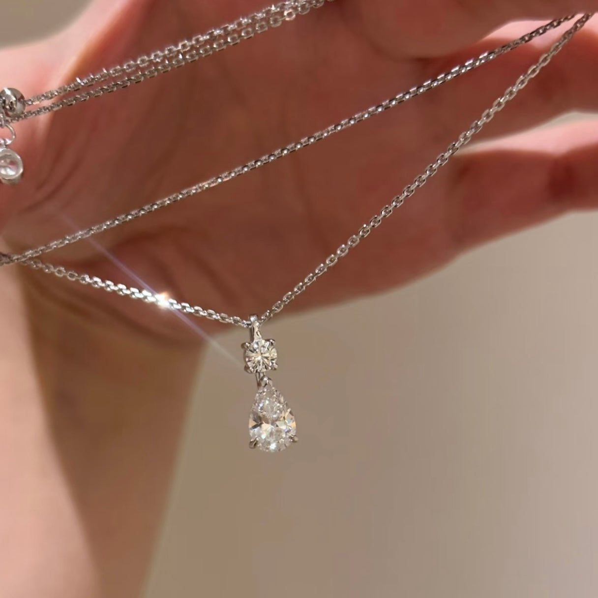 Close-up of the pear-shaped stone on the Diamond Dew necklace
