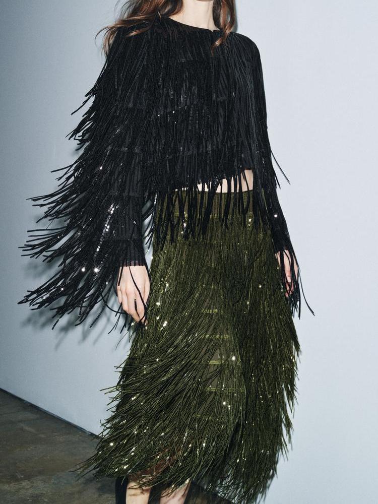 Close-up of the sequin fringe detail on the Elara midi skirt