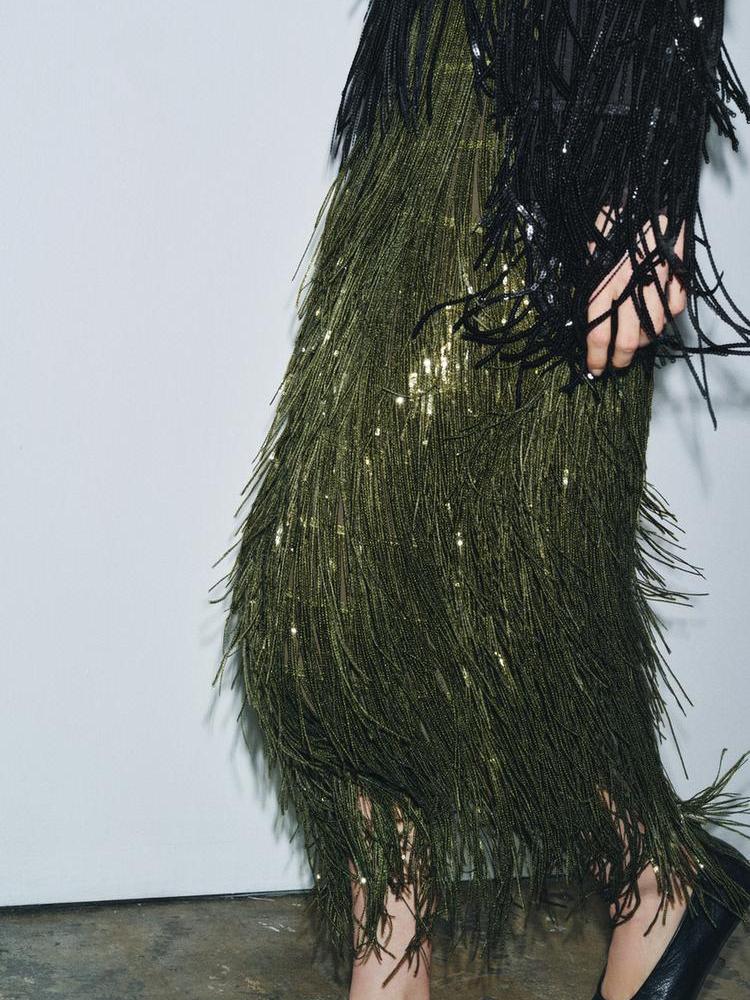 Back view of the Elara fringe midi skirt