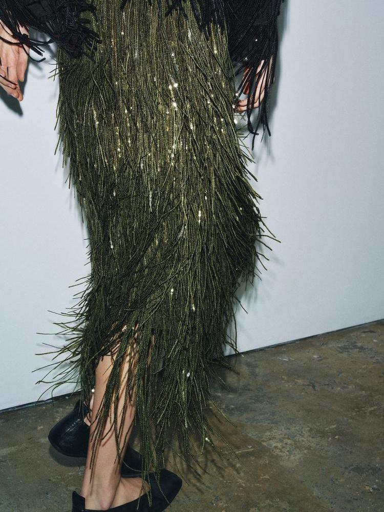 Elara fringe midi skirt styled for an evening event