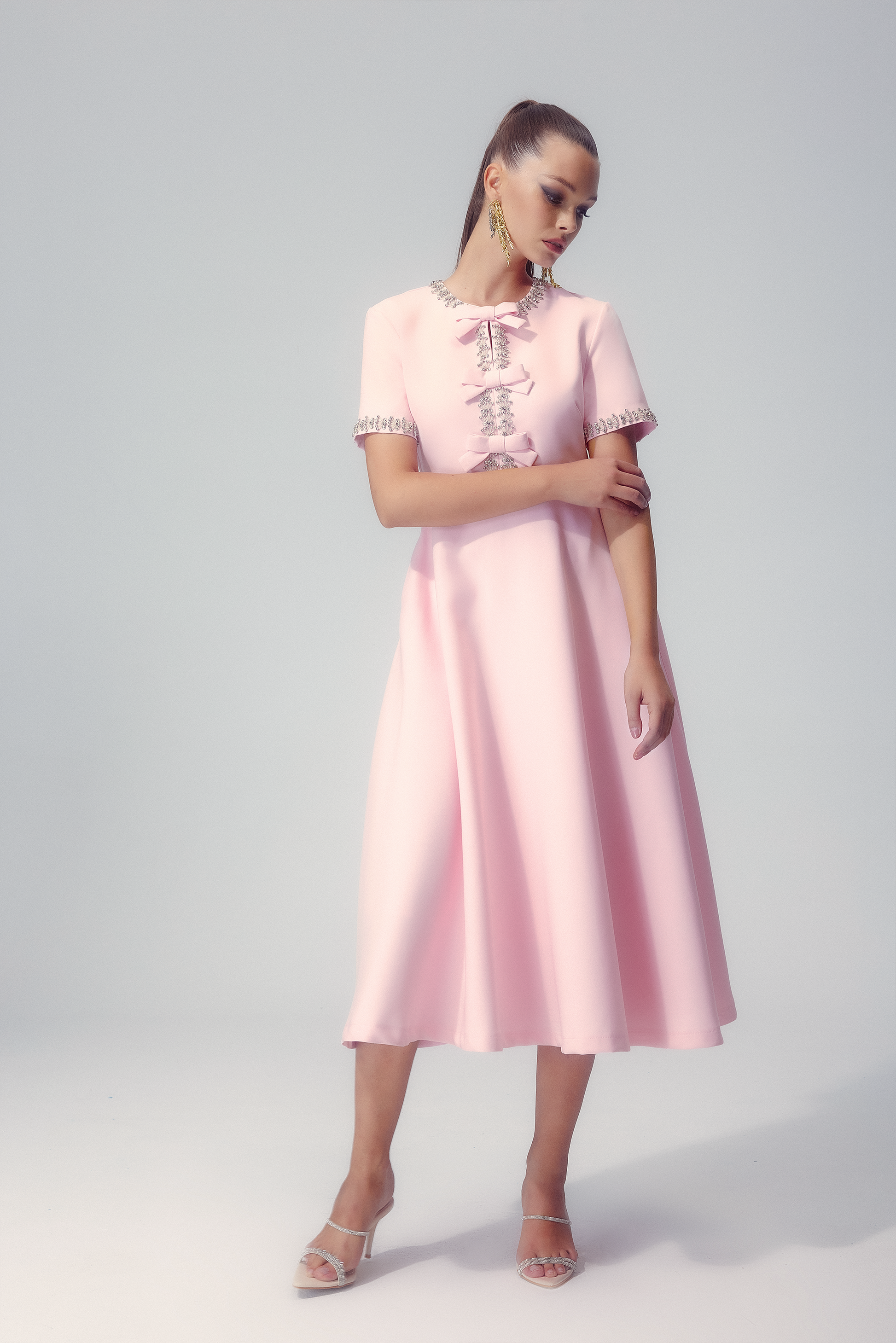 Elise crystal bow midi dress shown on a model