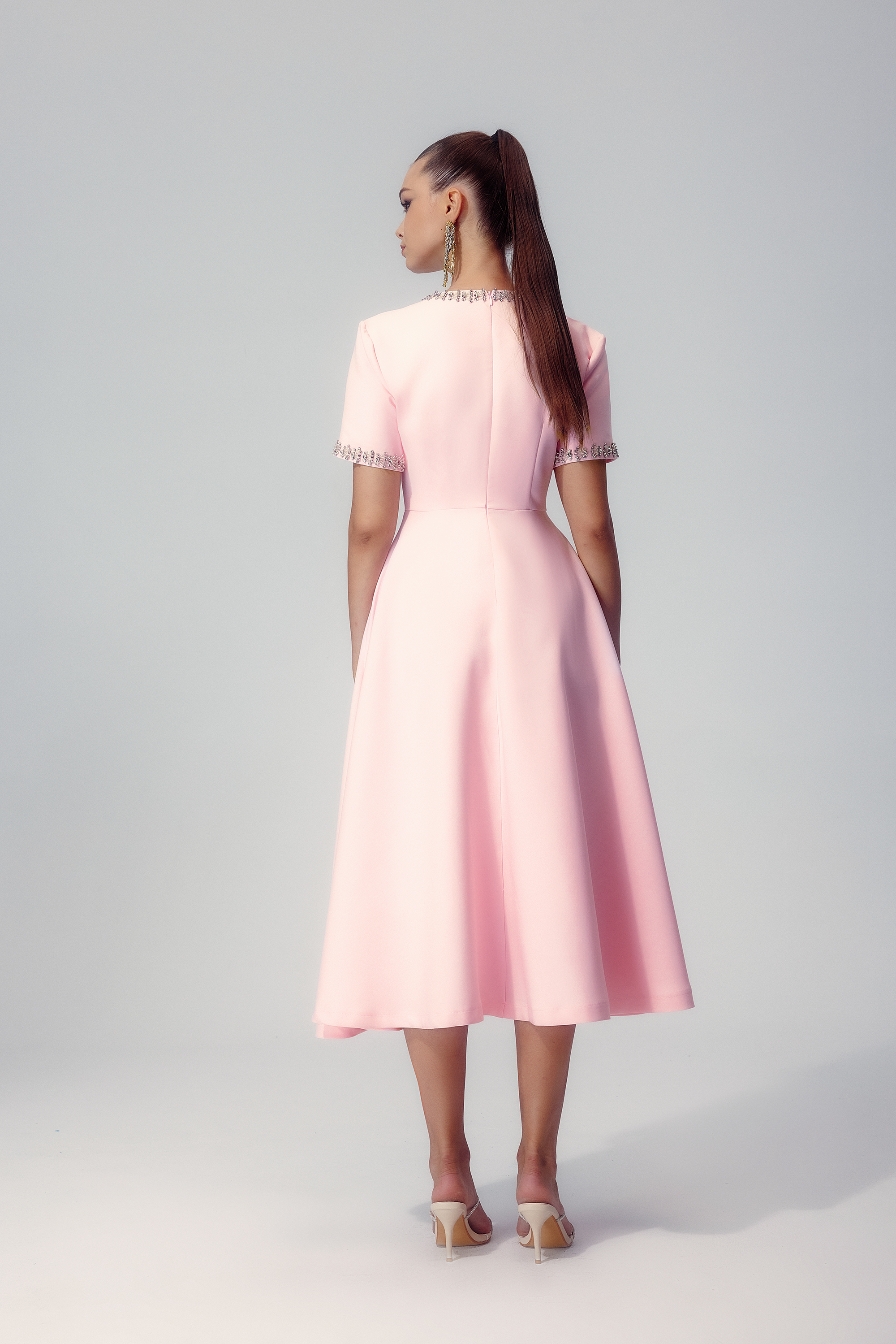 Flared silhouette of the Elise crystal bow midi dress