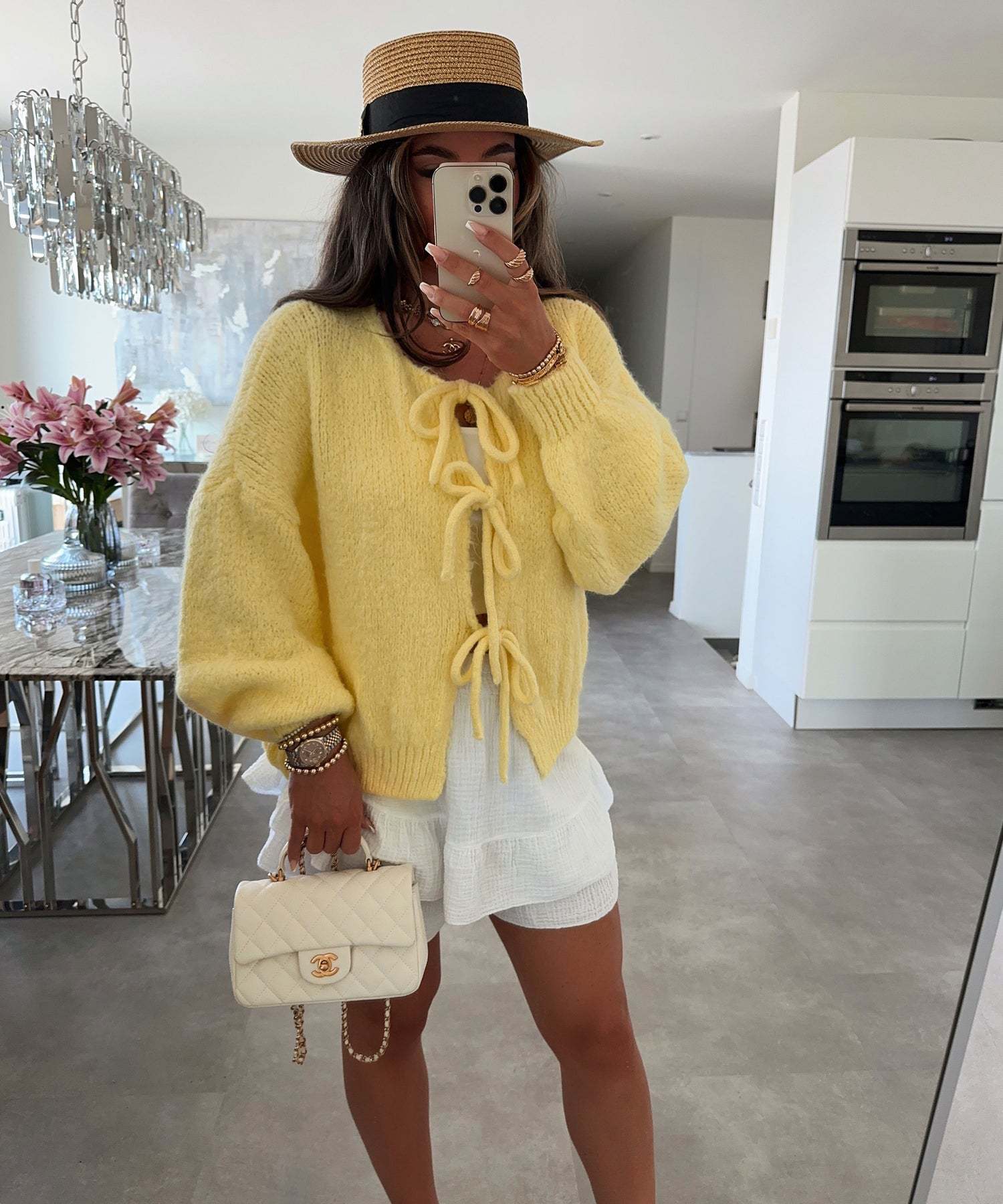 Elodie lace-up cardigan styled with a skirt