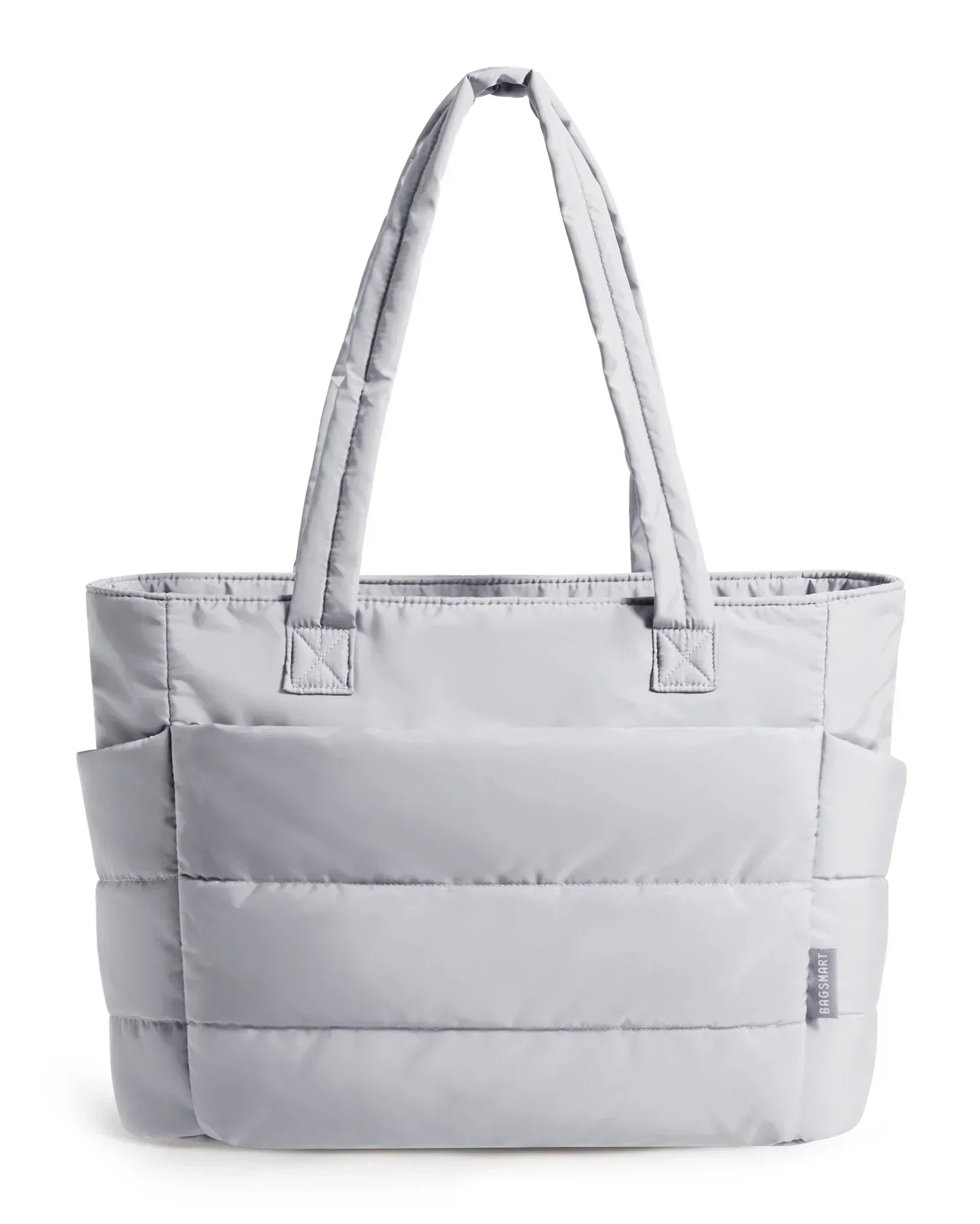 Ninna Fluff maxi bag shown with everyday essentials