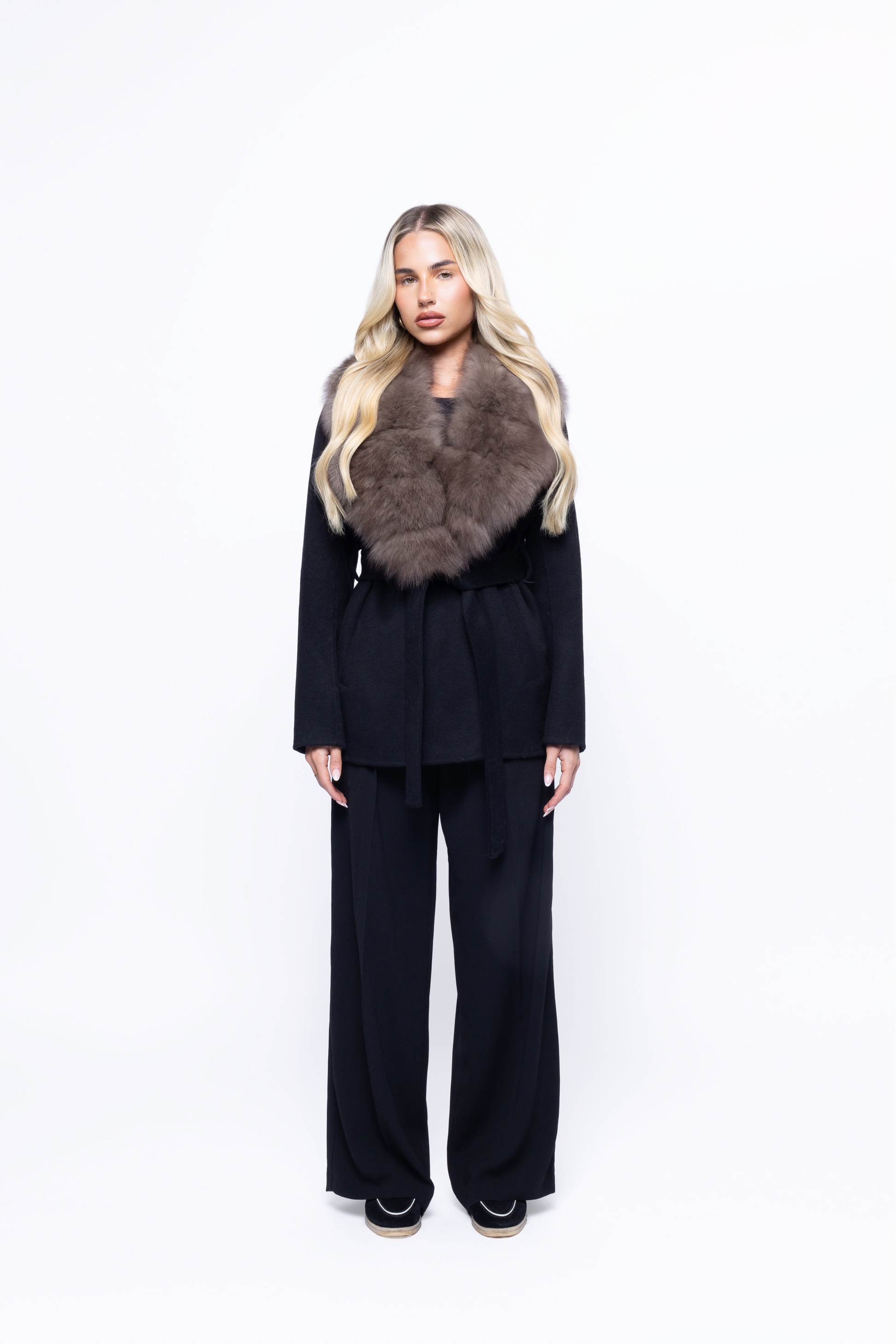 Noir Luxe faux fur coat in black worn by a model