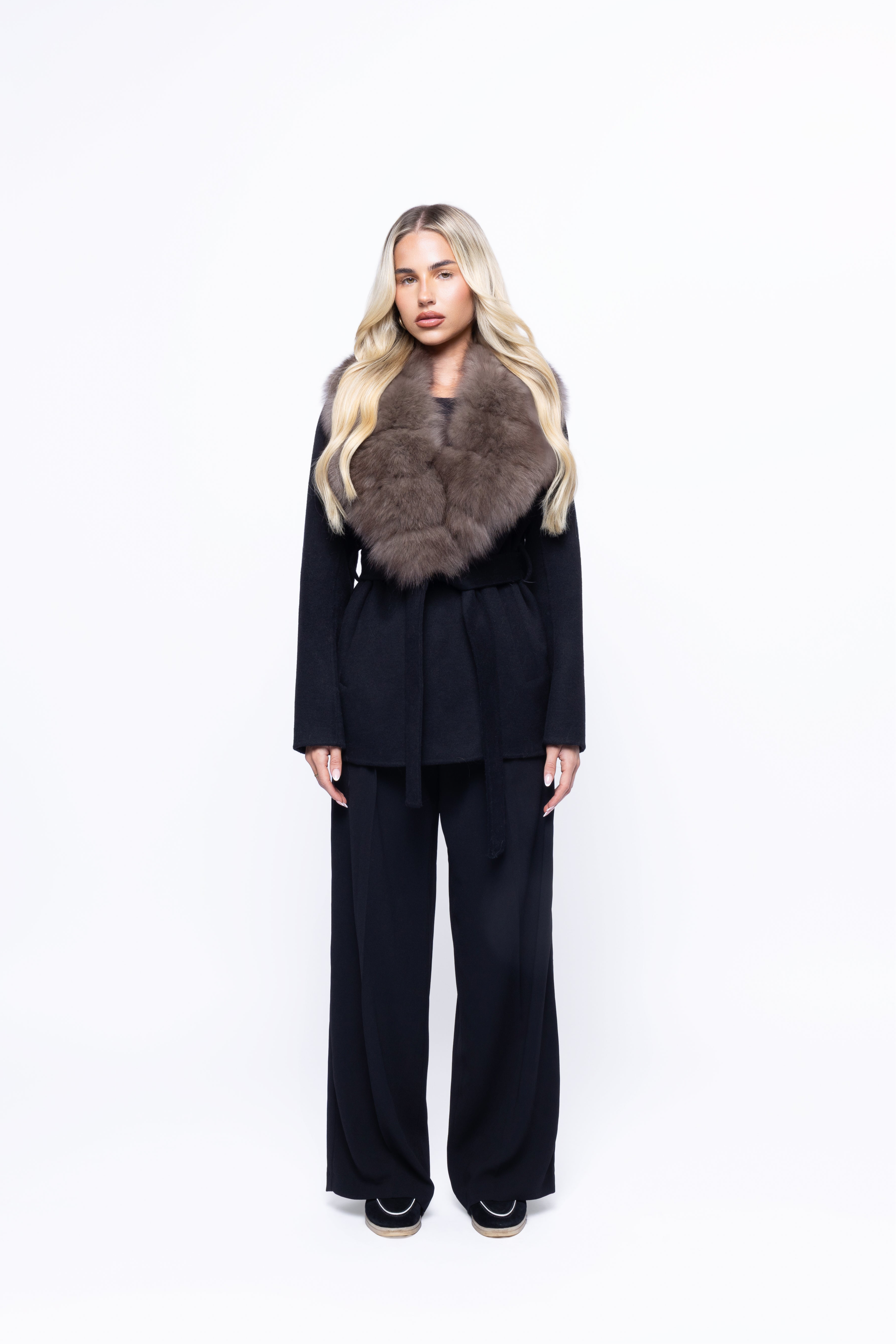 Noir Luxe faux fur coat in black worn by a model