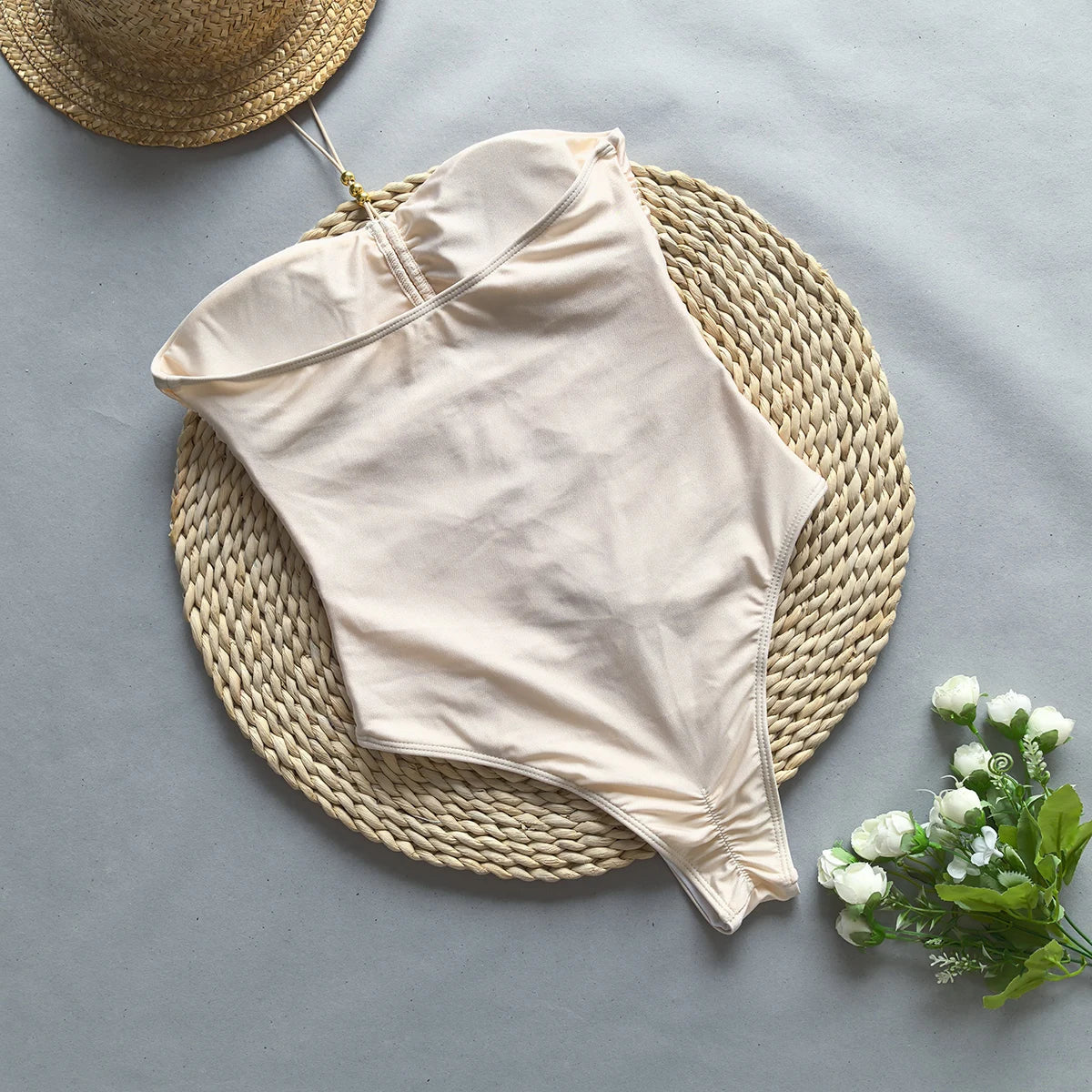 Ninna Suelly white bodysuit layered under a blazer